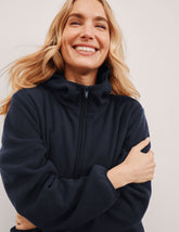 blue fleece quarter zip jacket with a kangaroo pocket.